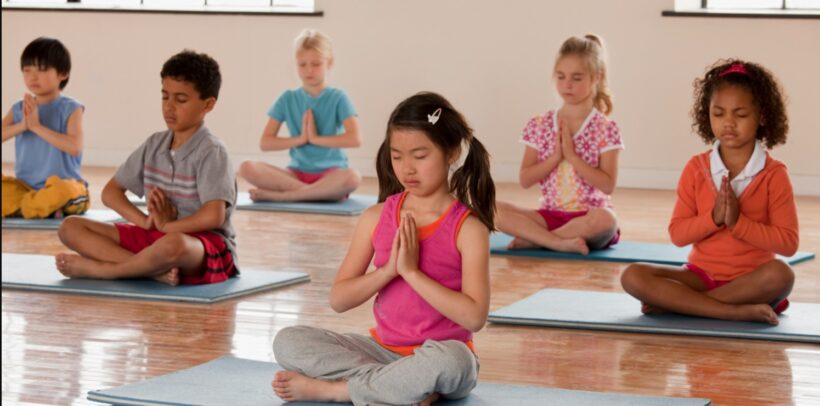 Kids learning yoga